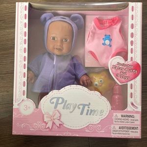 Play time baby doll comes with extra outfit and three tiny toys